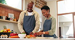 Kitchen, cooking and black couple with love, ingredients and happiness with food, bonding together and lunch. Man, woman or home with care, support and happiness with marriage, vacation and cheerful