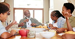 African, family and children in home for lunch, supper and eating meal at table together. Grandparents, parents and kids with food for bonding, relax and talking in dining room for relationship