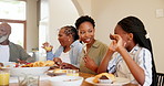 Talking, black family and children at table for lunch, supper and eating meal at home together. Happy grandparents, parents and kids with healthy food for bonding, relax and speaking in dining room