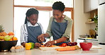 Kitchen, cooking and black family with mother, girl and love with food, bonding together and lunch. Parent, mama or kid with ingredients, learning or teaching with childhood development, home or meal