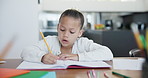 Girl, child and writing in home with homework, learning and notebook for education at dinner table. Student, person and kid with books, pencil and project or homeschool for knowledge and development