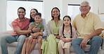 Smile, face and children with parents and grandparents on sofa in the living room together. Happy, portrait and kids relaxing with mother, father and senior man and woman in the lounge at family home