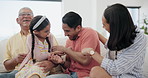 Happy, tickling and child with parents and grandfather on sofa in the living room together. Smile, laughing and girl kid playing with mother, father and senior man in the lounge at modern family home