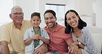 Happy, face and child with parents and grandfather on sofa in the living room together at home. Smile, portrait and boy kid relax with mother, father and senior man in lounge at modern family house.