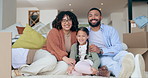 Family, portrait and insurance or happy for real estate, home owners and investment on floor. Support, man and woman with child, smile and new house with boxes, living room and property on ground 