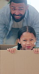 Happy family, moving in new home with box in real estate, property or investment and playing together. Excited father pushing child to exploring house, apartment or renovation in boxes for relocation