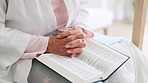 Hands, senior woman or bible study for Jesus Christ, religion or reading in holy spiritual scripture. Christian literature closeup, home or elderly person studying book to worship God in retirement