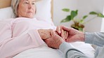 Home, holding hands and senior couple with care, retirement and compassion with empathy. Bedroom, elderly woman and old man with hope, help and comfort with sympathy, support and love with kindness