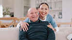 Face, hug and nurse with old man, love and happiness with retirement, medicare and laughing in a lounge. Portrait, caregiver and senior man on a couch, embrace and funny with humor, support and home