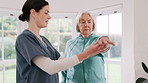 Woman, doctor and senior patient in physiotherapy, fitness or therapy exercise together at old age home. Female person, therapist or nurse in body warm up, arm stretch or muscle in health or wellness