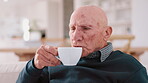 Senior man, coffee and enjoy in kitchen, home and peaceful to relax, drinking and alone. Retirement, old age and elderly in house, beverage and morning for espresso, man and delicious with aroma
