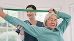 Woman, nurse and senior patient with resistance band in physiotherapy, fitness or exercise at old age home. Therapist or doctor helping mature female person in stretching, workout or therapy at house