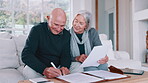 Senior couple, documents and bills for home budget, insurance contract and asset management success on sofa. Excited elderly people with paperwork, funding and writing or signature for loan agreement