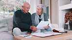 Senior couple, planning bills and home budget, insurance documents or talking of asset management on sofa. Elderly man and woman with paperwork for pension funding, retirement contract or mortgage 