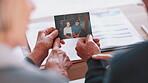 Photograph, memory and old couple in home remember date, event and marriage with nostalgia. Elderly people, hands and photography as a reminder of life in vintage picture and thinking of history