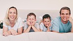 Face, home and family with happiness, bed and relax with weekend break, bonding together and calm. Portrait, happy parents and mother with father, children and boys in a bedroom, cheerful and peace