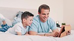 Father, smile and child with tablet in bedroom for online games, download multimedia or reading ebook story. Happy, dad and boy kid streaming cartoon, movies and digital website for elearning at home