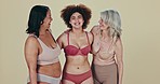 Body positive, diversity and women hug, smile and happy for self love, natural beauty or inclusivity. Woman empowerment, group inclusion and support friends in lingerie underwear on studio background