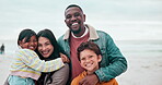 Family, face or happy on beach with hug, love and bonding on vacation, holiday or adventure by ocean. Interracial, parents and kids with portrait at sea for experience, affection or care and smile