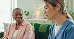 Senior, woman and caregiver with tablet for consulting, communication and discussion for healthcare on sofa. Elderly, person and nurse with touchscreen for conversation for health, report or analysis