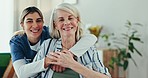 Senior care, old woman in wheelchair and nurse hug, support and smile with healthcare advice in home. Homecare, elderly patient and happy caregiver in living room for consultation, help and kindness.