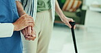 Walking stick, hands support and nurse with senior patient for healthcare service and home retirement. Physiotherapy, medical caregiver or doctor helping elderly person with disability and balance