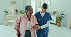 Nurse, senior woman and walking stick for physiotherapy support and healthcare service in clinic office. Physiotherapist, medical worker or doctor helping elderly patient with disability and mobility