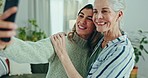 Love, selfie and woman with senior mother in a living room with memory, moment or bond. Phone, profile picture and female person with elderly mom in a living room pose for social media, blog or post