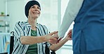 Healthcare, comfort and nurse with senior patient in wheelchair for cancer treatment in hospital. Smile, discussion and caregiver holding hands for support with elderly woman in medical clinic.