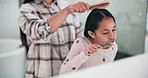 Mom, girl child and brushing teeth in bathroom, support and hygiene with hair care, mouth or love in morning. Comb, mother and daughter kid with toothbrush, together and helping hand in family house