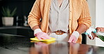 Hands, family or child cleaning house or kitchen with spray for learning, germs and bacteria for clean home. Woman teaching young girl to wipe surface with cloth to help with housework chores 