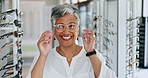 Glasses, client shopping and senior woman face with check and optometrist with eye test. Decision, customer and store with prescription eyewear and lens with frame choice and smile at a retail shop