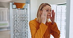 Vision, shopping and woman with choice of glasses at optician shop, health and eye care. Frame, lens and customer at ophthalmology store, retail or sale, buy or trying eyewear for eyesight in clinic