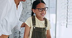 Optometrist, child and choice for glasses, smile and eye care for healthcare, assessment and decision for eyewear. Happy girl, medicare and excited for frame, optometry and consulting or wellness