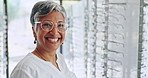 Face, glasses and store with woman, retail and eye care shopping with happiness, lens and wellness. Portrait, person and model with eyewear, frame or health insurance with happiness, customer or sale