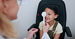 Eye exam, patient and optometrist cover child vision for optical service, ocular support and test youth retinal focus on pin. Clinic, optometry equipment and check young kid client for strabismus