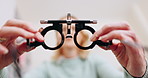 Pov, glasses and test for eyes with optometrist hands, closeup and helping for wellness in clinic. Ophthalmologist, lens and frame for exam for eyesight, healthcare or vision with hospital assessment