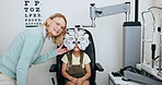 Vision, optometry and optician with child on phoropter for testing, sight and machine for eye exam. Healthcare consulting, medical tools and young patient with woman for ophthalmology scan in clinic