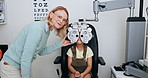 Eye exam, optometry and woman with child on phoropter for testing vision, sight and machine for eyes. Healthcare, medical equipment and young patient with woman for ophthalmology scan in clinic