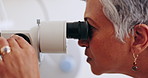Eye care, machine test and mature woman in office to check iris, pupil and sight with professional. Technology for vision exam, light and doctor in clinic for assessment for glasses, lens or glaucoma