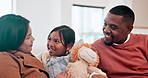 Happy, conversation and children with parents on a sofa in the living room of modern family home. Bonding, having fun and young kids talking to interracial mother and father in the lounge of house.