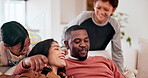 Love, smile and energy with a family on a sofa in the living room of their home together for the weekend. Happy, excited and children running to hug their parents for bonding in an apartment