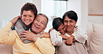 Happy family, grandparents and children hug on the sofa in a living room of their home for visit. Portrait of a senior man and women with kids on a couch with a smile, love and excited or care