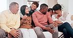 Happy, conversation and big family on a sofa at their home for bonding together on a weekend. Smile, love and young children talking with grandparents and parents on couch in lounge at modern house.