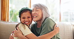 Happy, grandmother and girl on sofa hug for bonding, relationship and relax together in living room. Home, family and senior Asian woman with grandchild on couch embrace for care, laughing and love