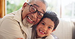 Face, love and grandfather hug child on sofa with support, trust and security at home. Happy, portrait and excited senior man embrace kid in living room for bond, fun and retirement with babysitting