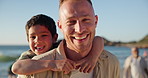 Face, piggyback and happy child with father at beach,  together on holiday or vacation, summer or travel. Portrait, dad carrying kid at ocean and sea for care, love and bond, support and connection