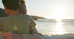 Father, kid and hug on beach with sunshine, happy family and love in nature for connection. Dad, boy and care with smile in cape town, sustainability and ocean horizon on summer vacation in wellness