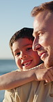 Face, piggyback and kid with father at beach, happy together on holiday or vacation, summer or travel. Portrait, dad carrying child at ocean and sea for care, love and bond, support and connection