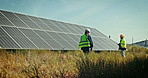 People at solar panel plant for inspection, clean energy and outdoor electricity maintenance. Sustainability, photovoltaic power grid system and woman technician walking to engineer for safety check.